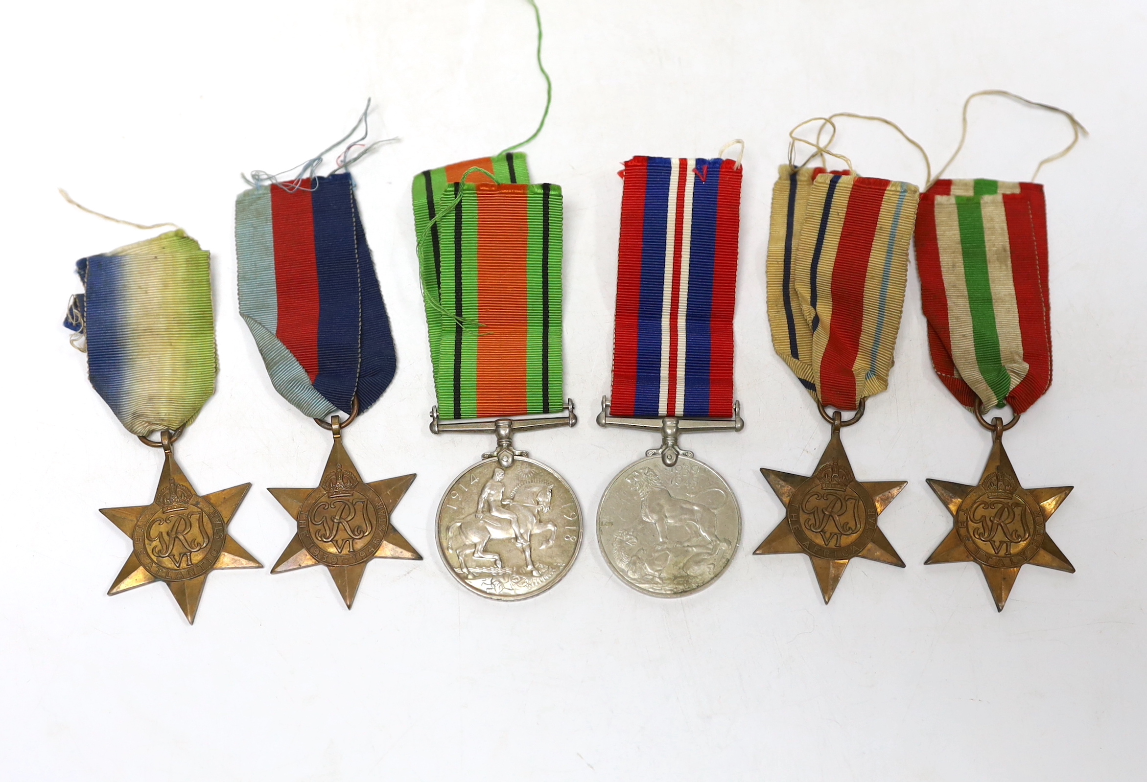 Six WWII medals. The Atlantic Star, The Italy Star, The Africa Star, The 1939-45 Star, The Defence Medal and The War Medal